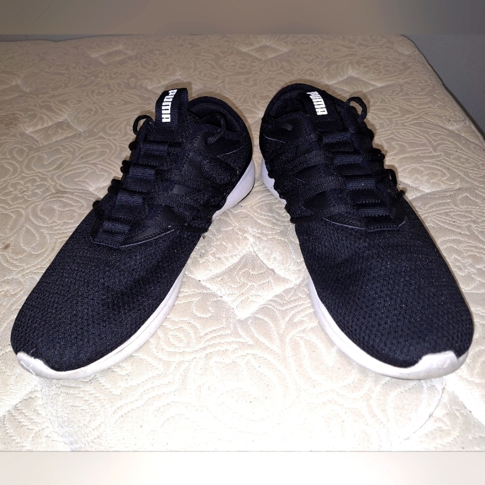A pair of Puma sneakers in a Men's 13. Pre-owned and in great condition.